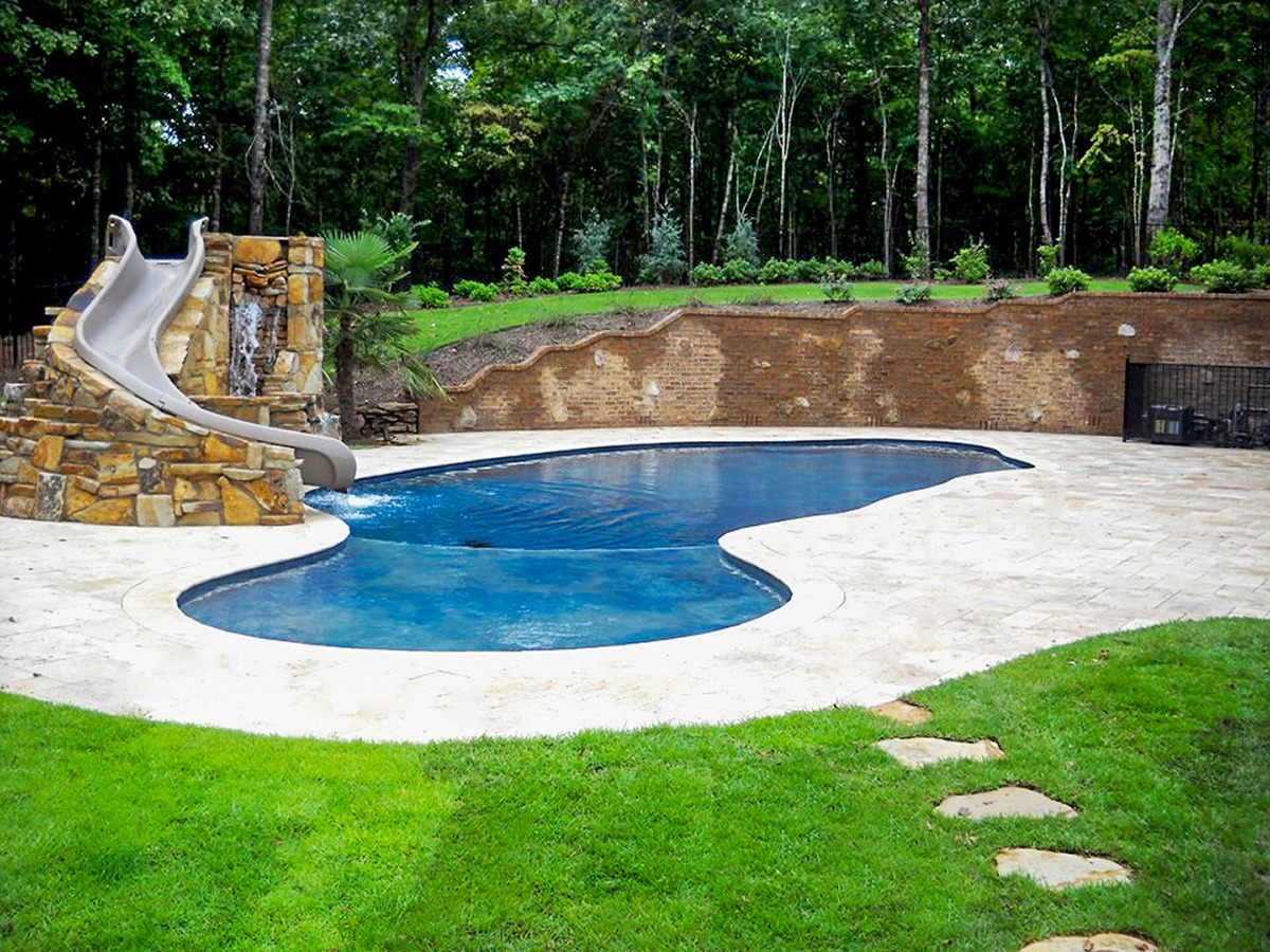Law Pools & Patio Mediterranean Midnight Freestyle Pool – Patio, Slide, & Natural Stone Waterfall